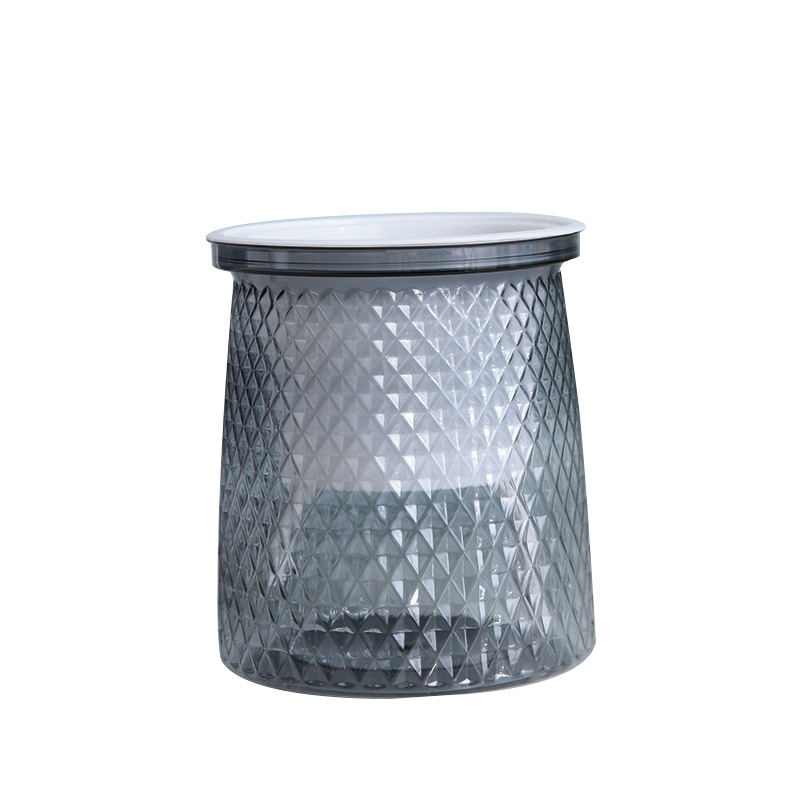Cesta interior de cristal gris con cuerda.