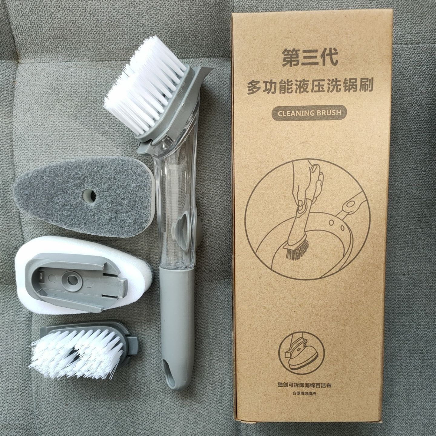 A pot scrubber with one brush head and two sponge heads.