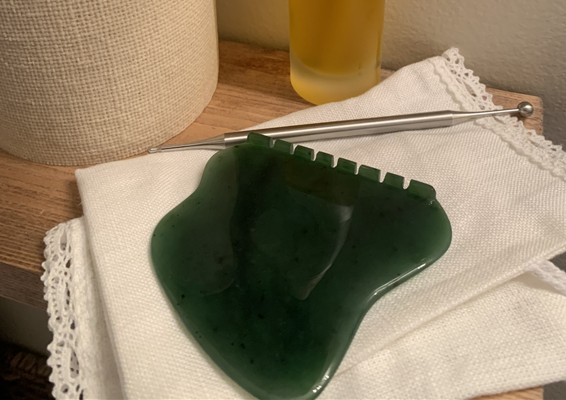 green Facial reflexology tools and gua sha