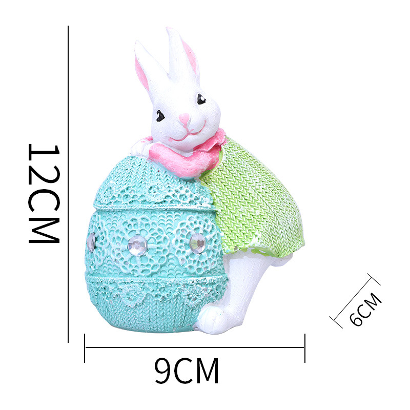 Autocollant œuf de Pâques bleu visage lapin vert