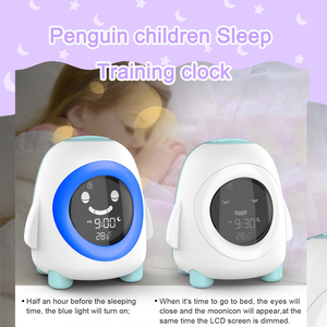 子供の目覚まし時計色の常夜灯が付いている幼児の睡眠のトレーニング時計は子供のためのペンギンの目覚まし時計を目覚めさせる機械の時間を鳴らします