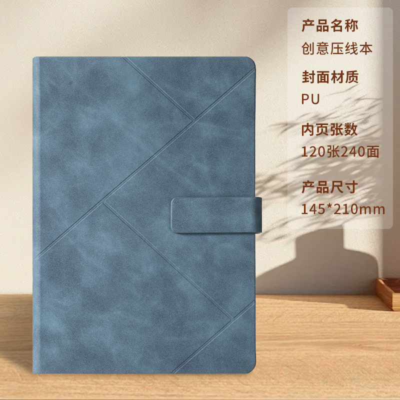 Libro con hebilla prensada azul grisáceo.