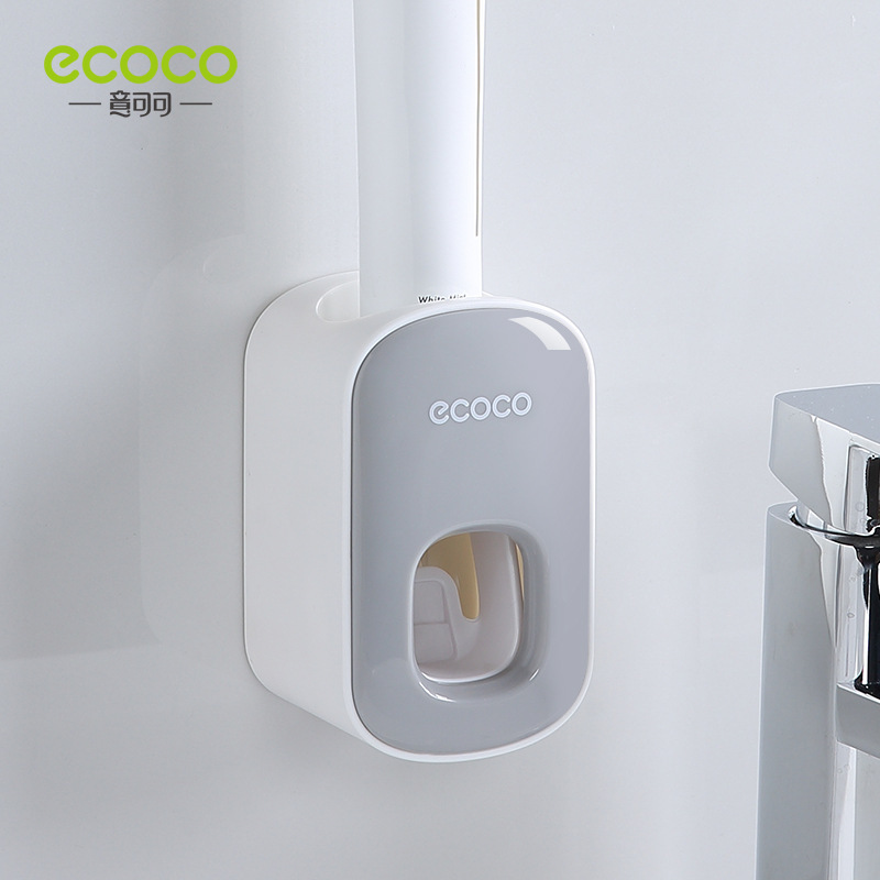 Toothpaste dispenser grayish white
