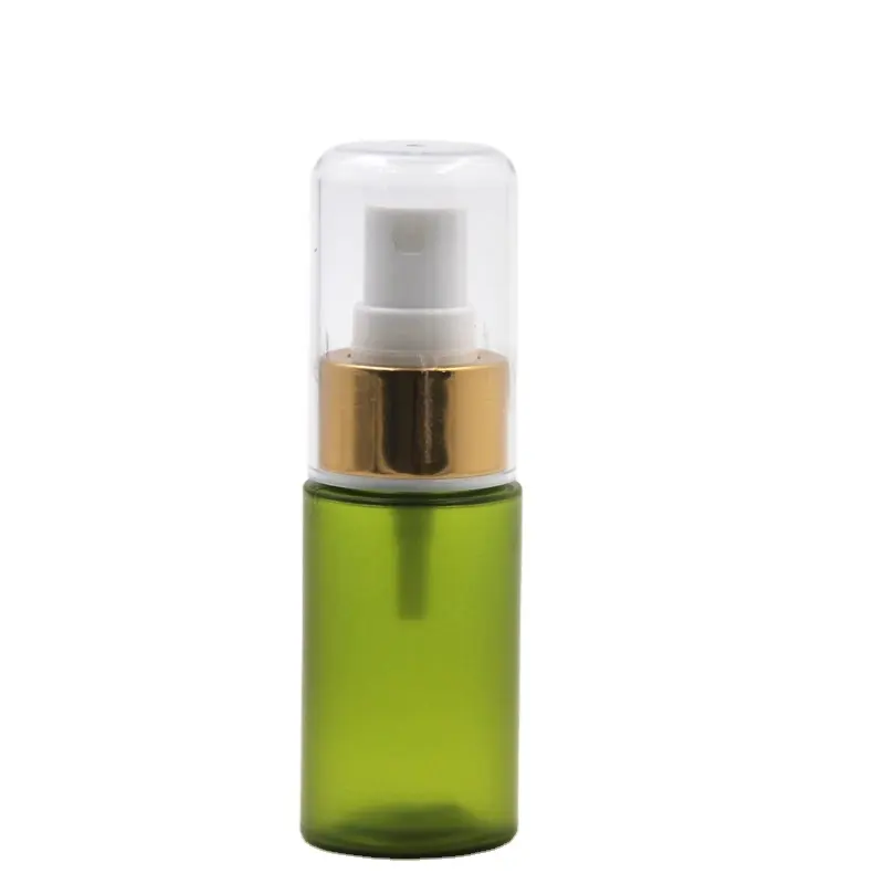 Échantillon Flacon pulvérisateur en plastique Mini flacon de parfum portable de couleur verte givrée avec fine brume Bouchon doré Marque privée