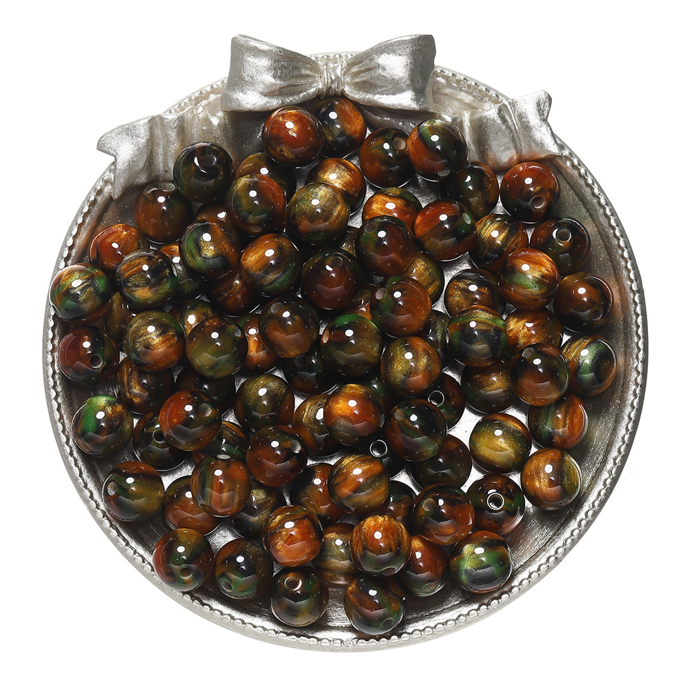 Resin cat's eye beads - orange-green