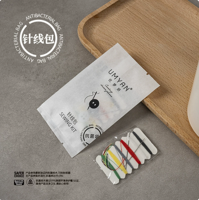 6 hilos, 2 agujas, 2 botones
