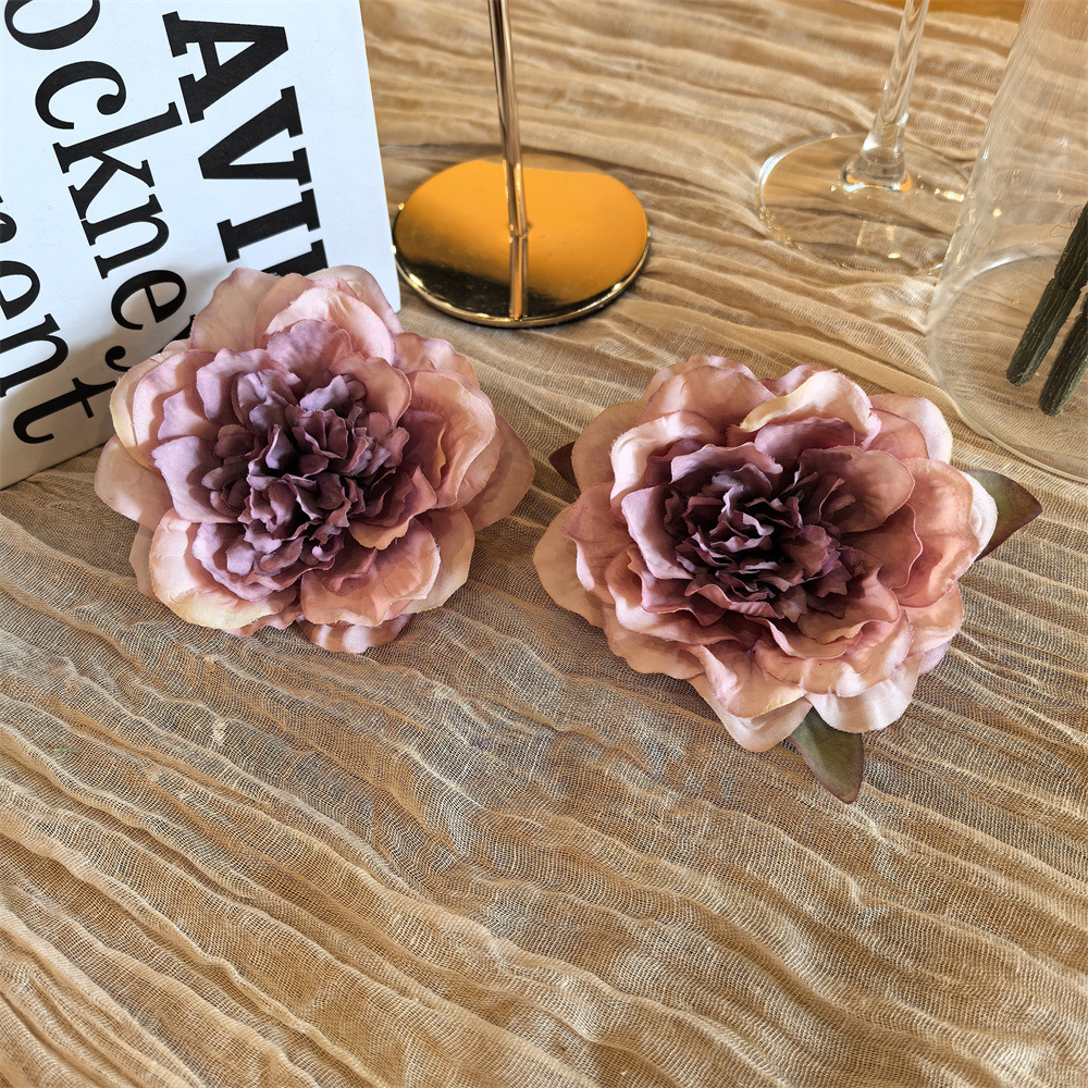 A pair of senior coffee peony shoe clips