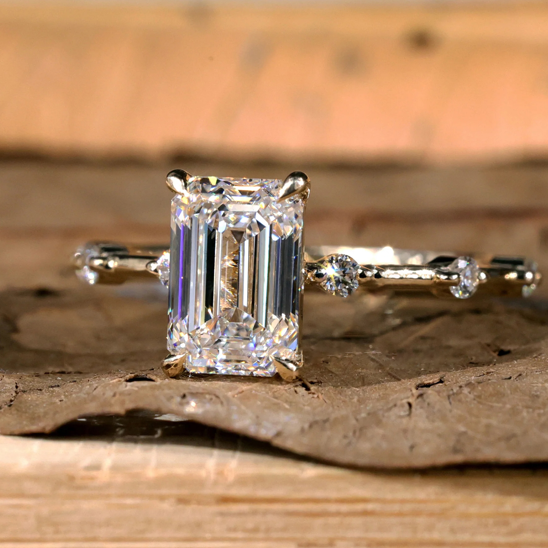 emerald side-stone ring