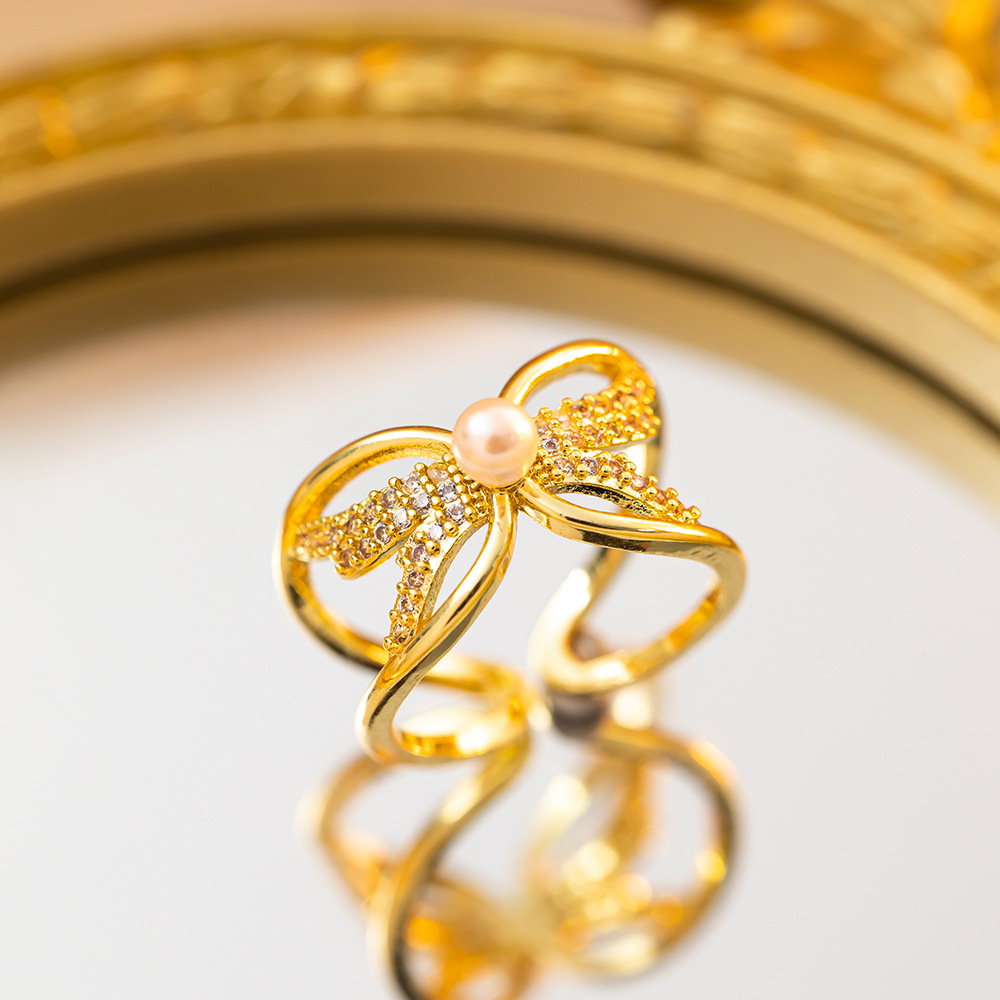 Bague nœud avec perle, or