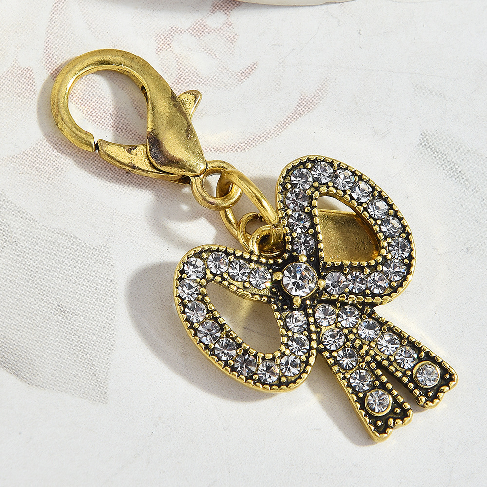 Petit pendentif noeud doré