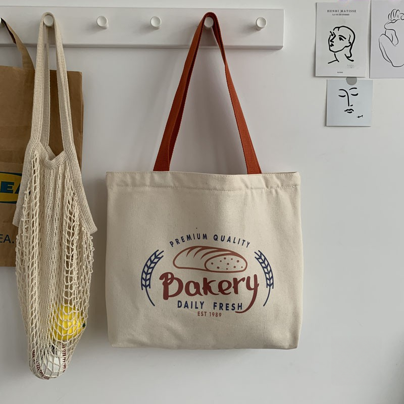 white bread-orange shoulder strap
