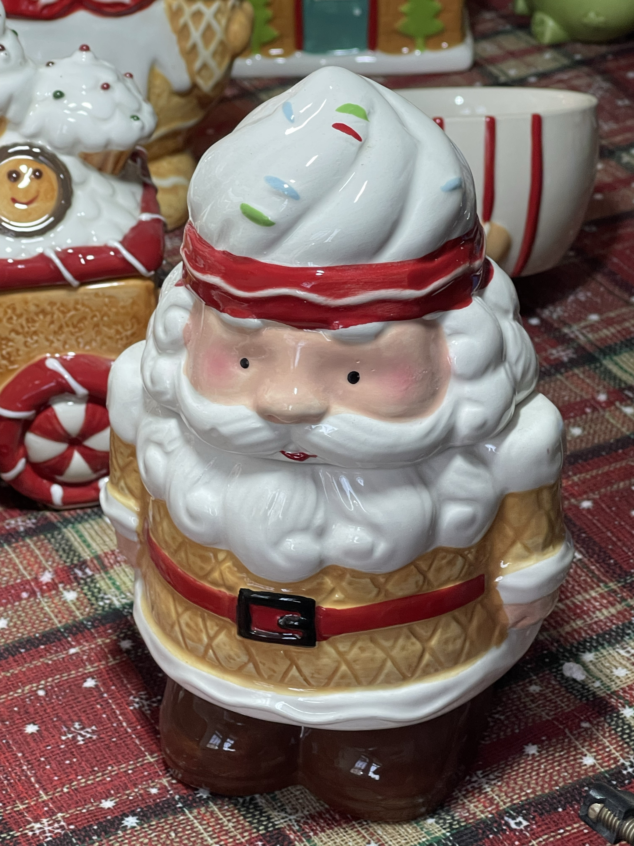 Gingerbread Santa storage jar with two holes in the back