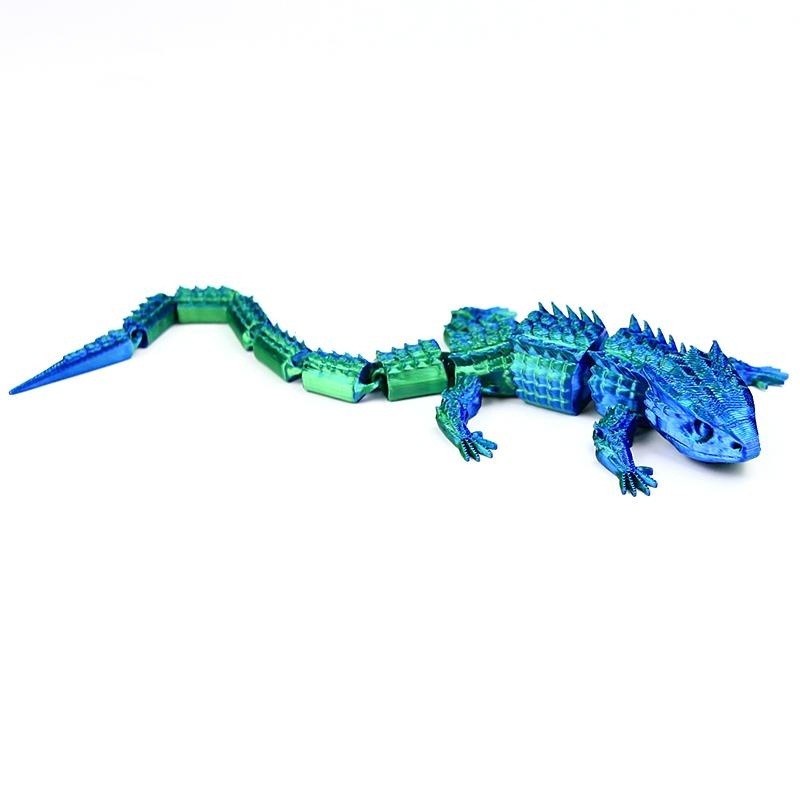 Lagarto azul verdoso de 22,5 cm.