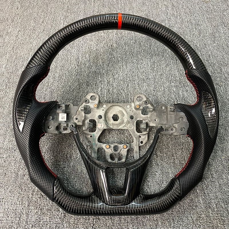Fibra de carbono + cuero perforado