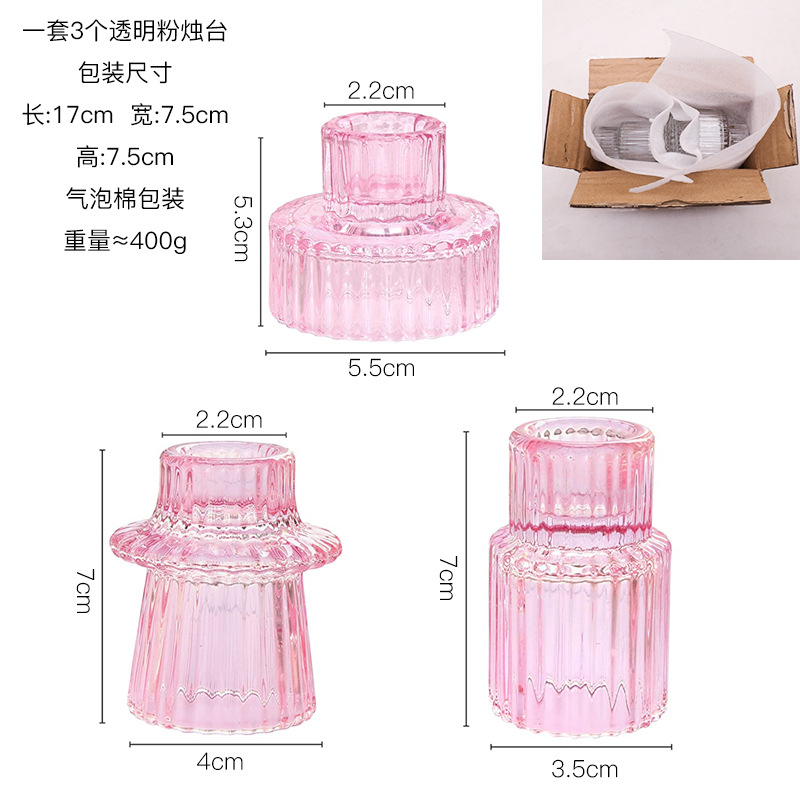 Ensemble de trois bougeoirs en verre rose