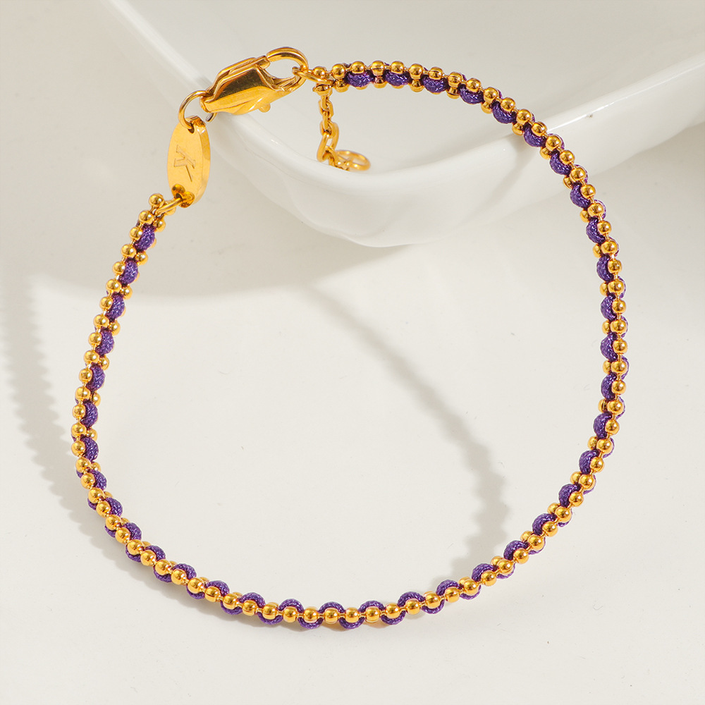 petit bracelet en corde violette tressée dorée