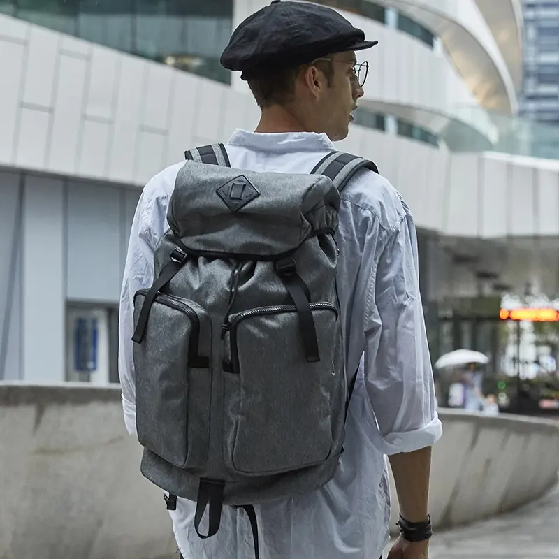 Venta al por mayor de poliéster gris duradero impermeable casual al aire libre viaje portátil cordón moda mochila