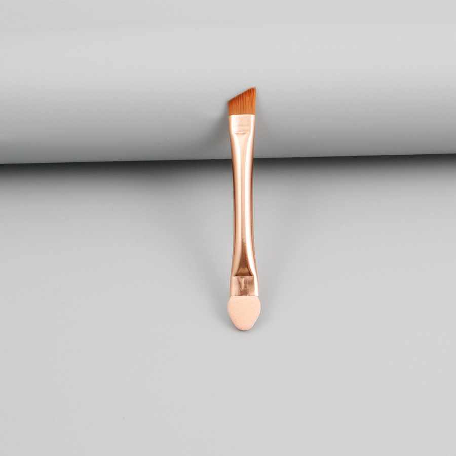 Tête oblique en or rose