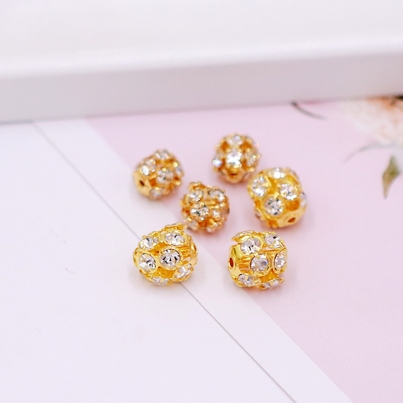 1 base de oro con diamantes blancos