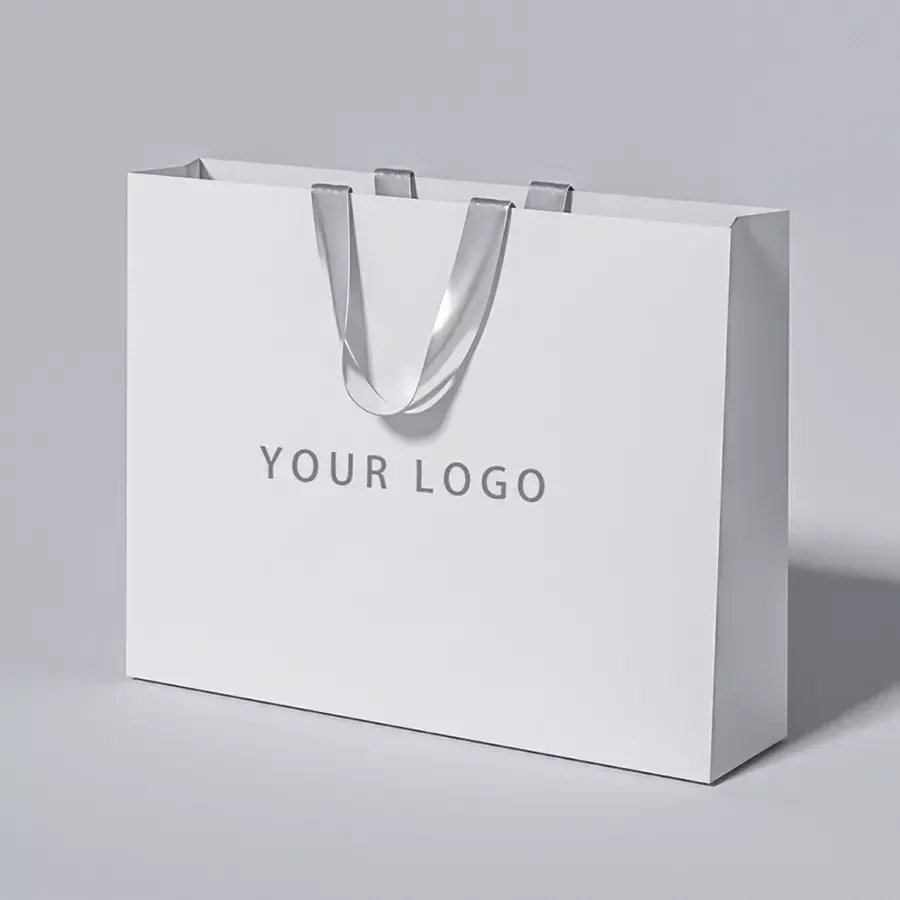 カスタマイズされた独自のロゴを印刷する化粧品の靴のための高級ブランドのショッピングペーパーバッグリボンハンドル付きギフトブティックバッグ