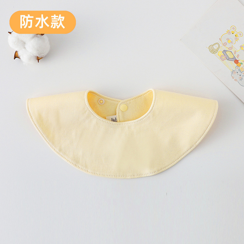 Redondo, doble cara, impermeable, color crema amarillento.