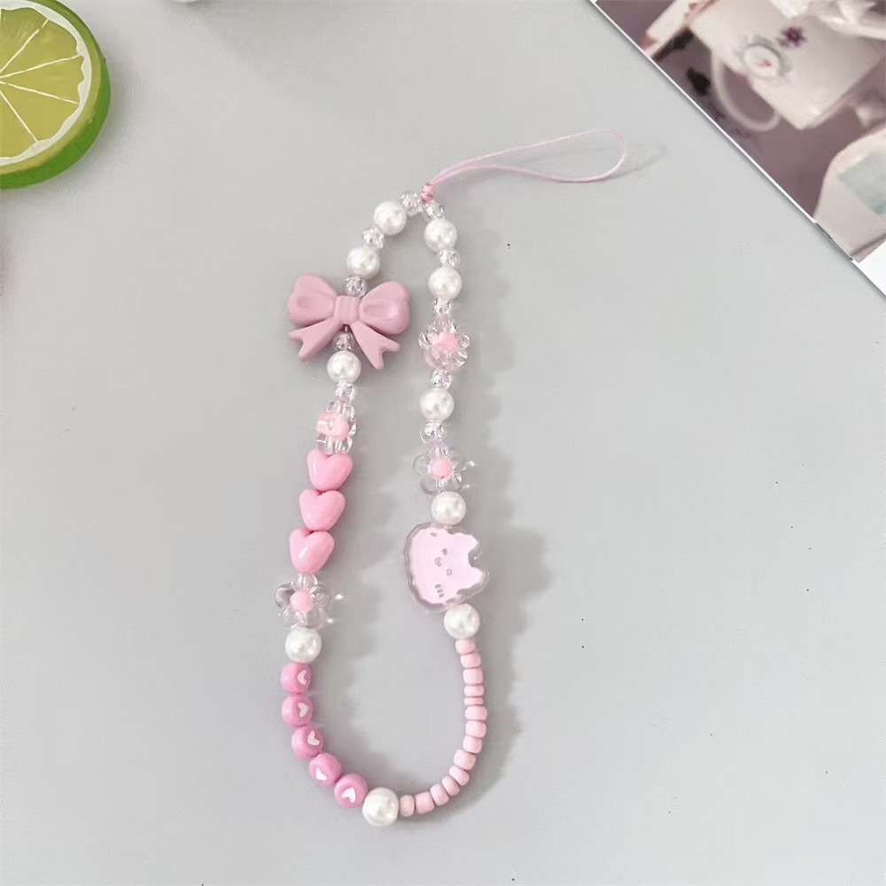 Fiocco rosa e testa di gatto rosa