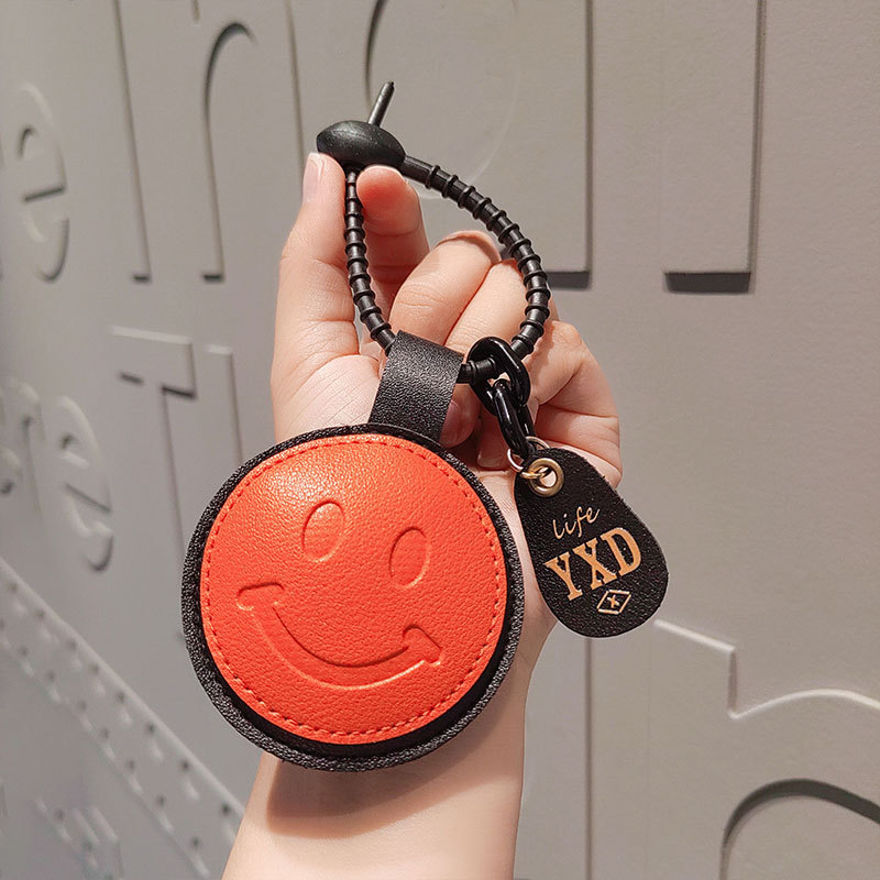 Smiley in pelle arancione