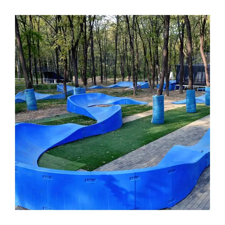 Plastic modular pump track is a sequence of roll overs  bumps  and berms  corners  for bikes  scooters and skateboards