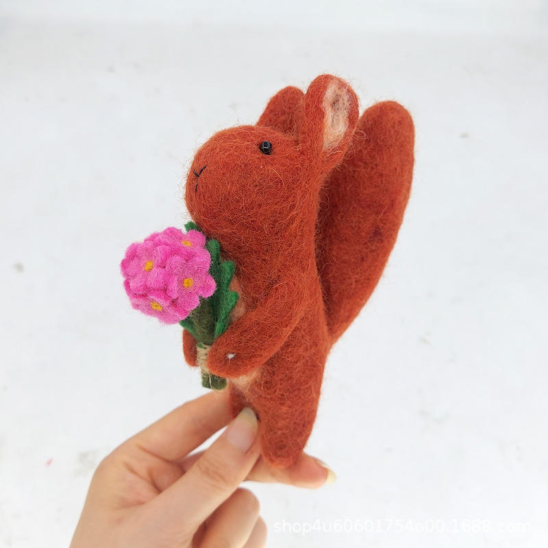Squirrel holding flowers