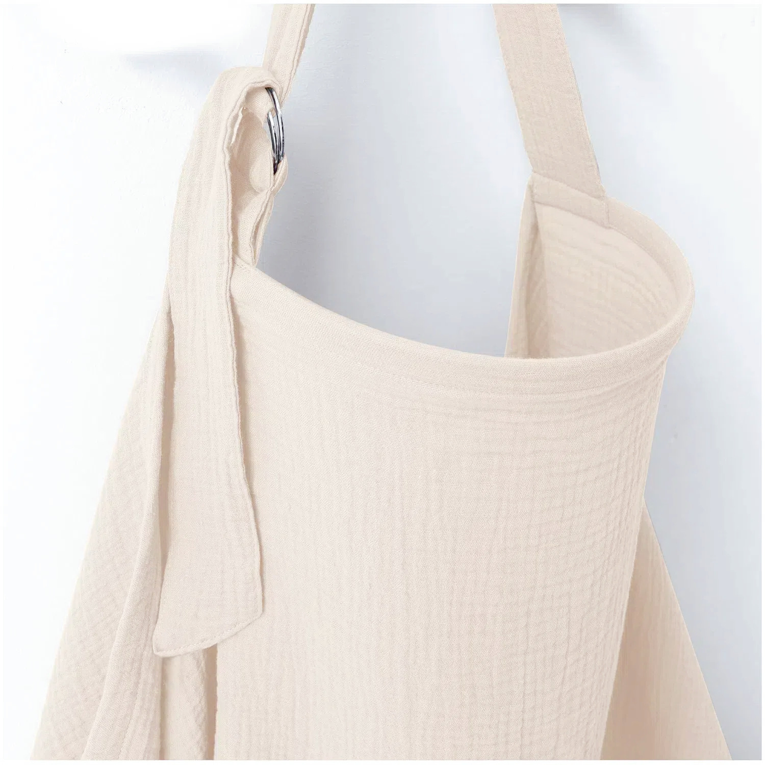 Housse d'allaitement beige en mousseline pour bébé