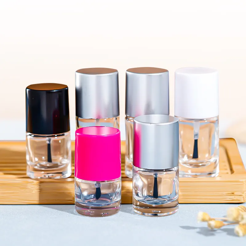 Pot distributeur de cosmétiques bouteille cylindrique transparente en verre de vernis à ongles avec brosse et couvercle