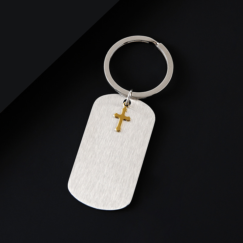 Silver key ring with gold cross