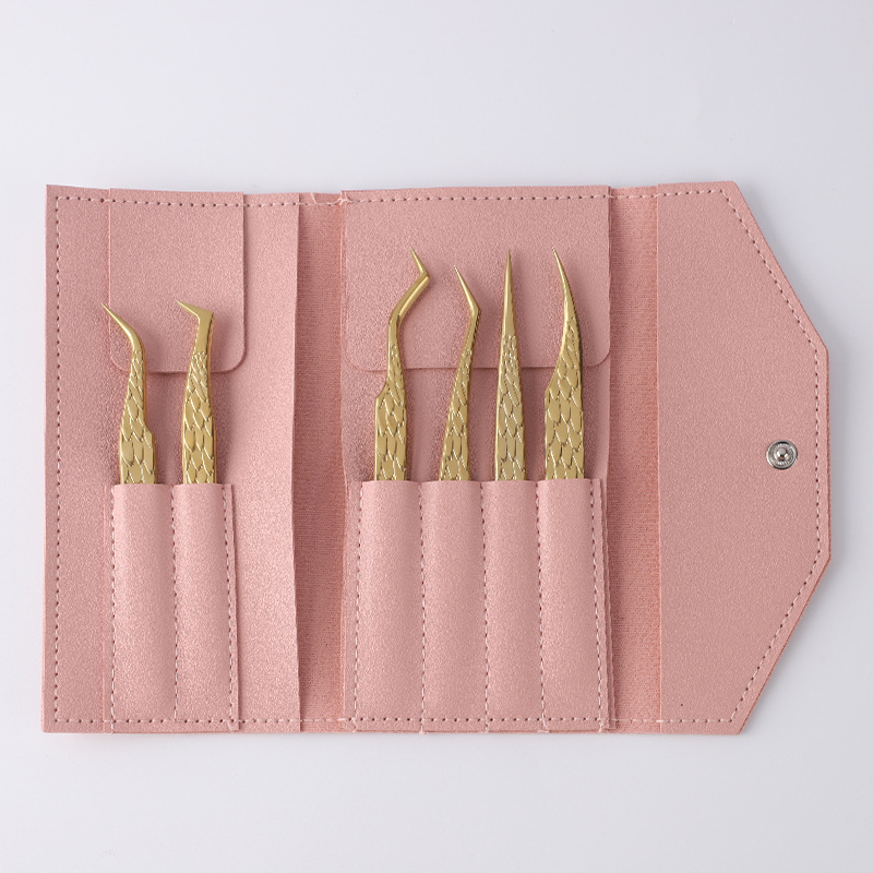 Set de 6 piezas: Ángel de titanio con bolso de cuero rosa.