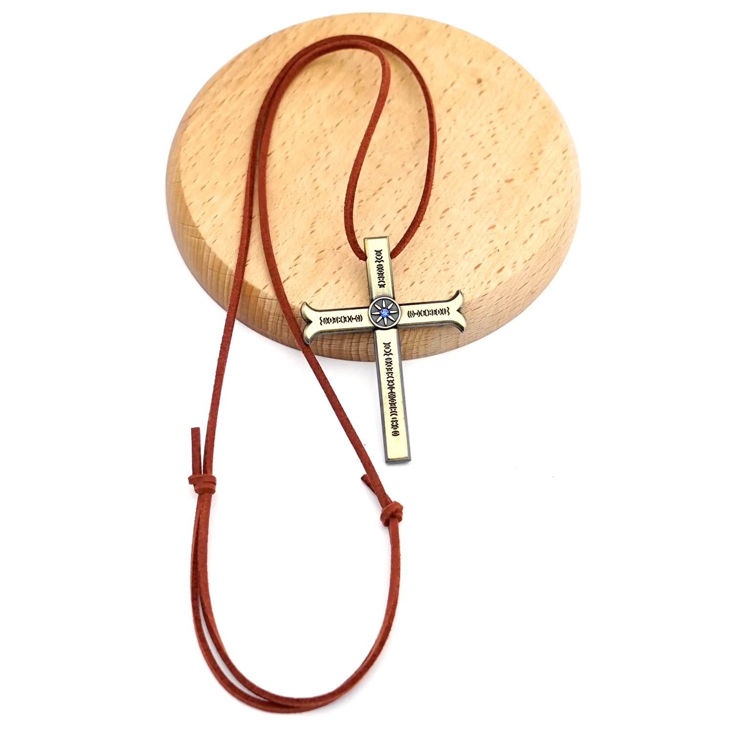Bronze cross and brown rope chain