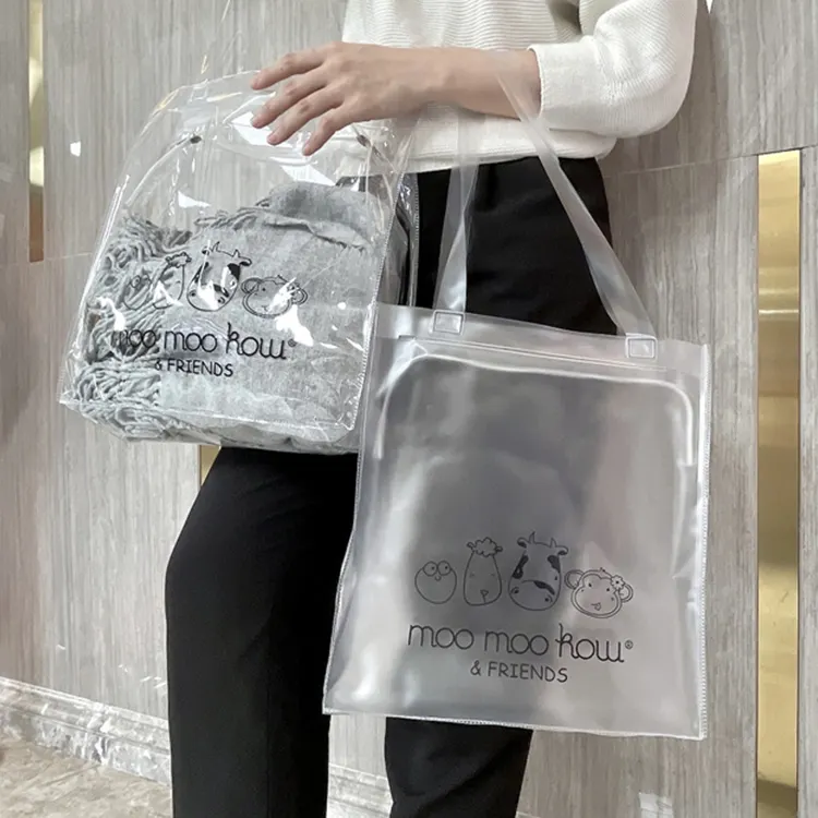 Logo imprimé personnalisé OEM eco luxe imperméable transparent pvc petit sac à main à fermeture éclair cartoon sacs à provisions