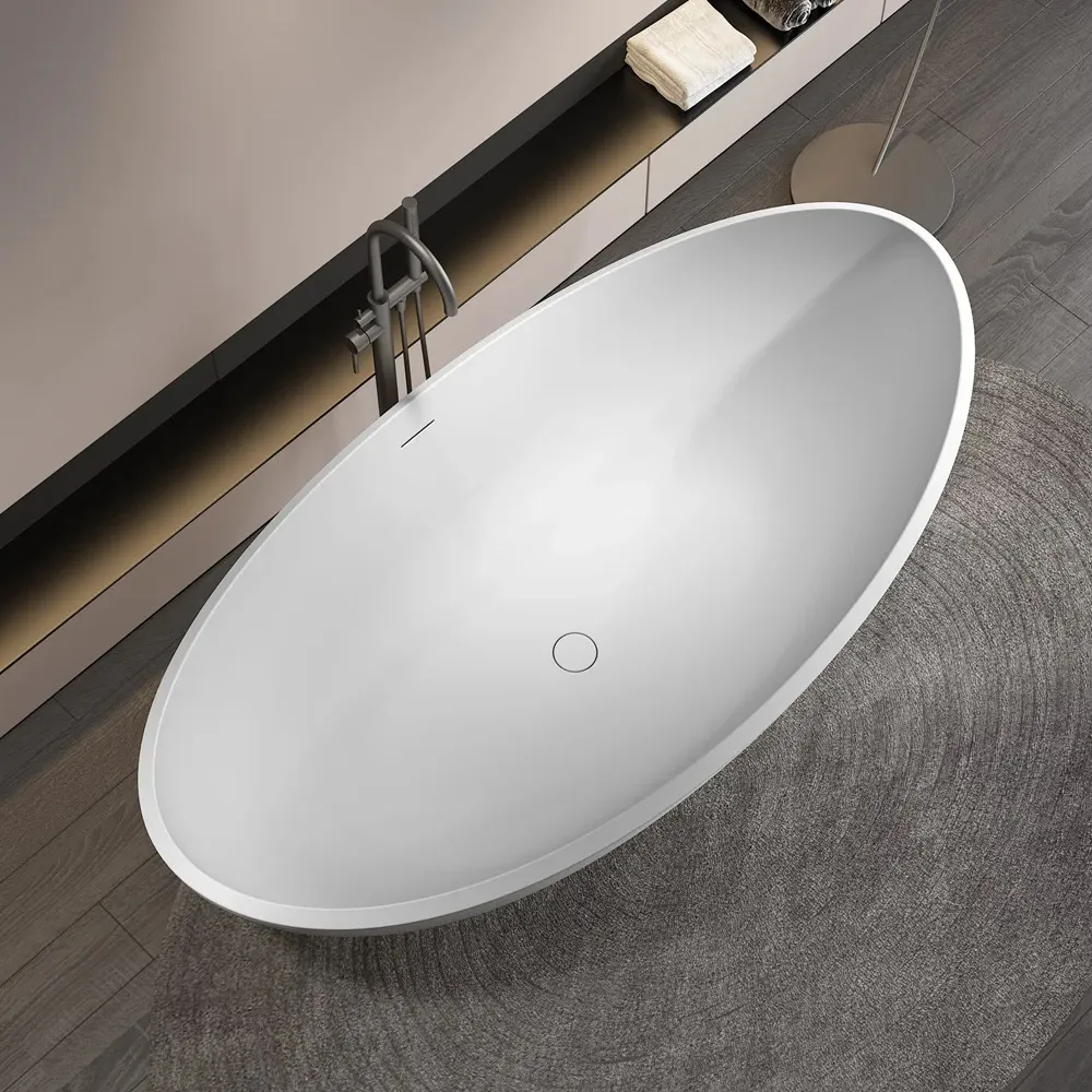 大人のバスルーム用の白いセンタードレンを備えたモダンな楕円形のアクリル自立型浴槽浸漬固体表面浴槽