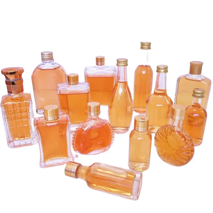 Botellas de embalaje de vidrio transparente de diferentes tamaños, con tapón de Metal de tornillo de Color dorado y plateado