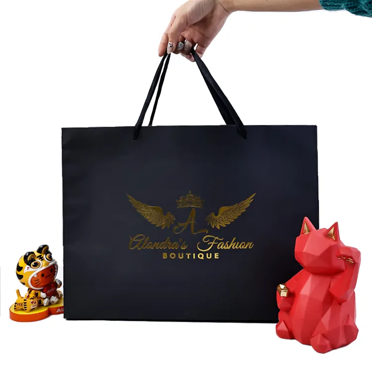 Bolsas de papel de boutique de cartón negro de lujo para regalo de compras personalizadas con logotipo impreso de marca de lámina de oro personalizado