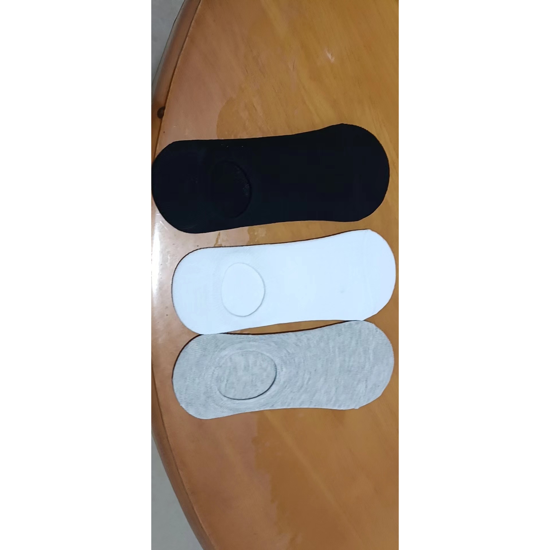 Men's invisible socks in black, white, and gray color scheme