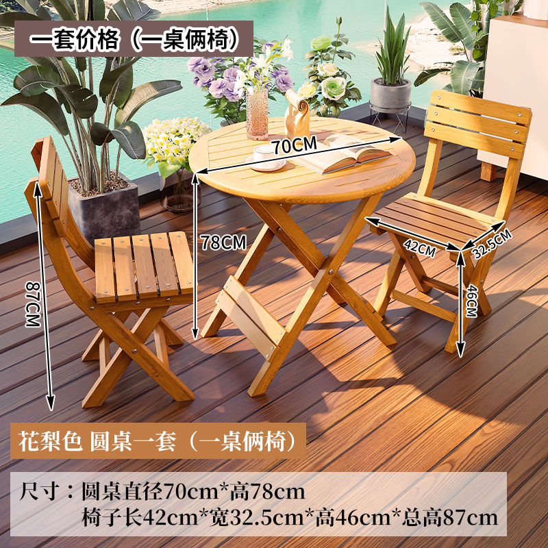 One round rosewood table with two upholstered chairs
