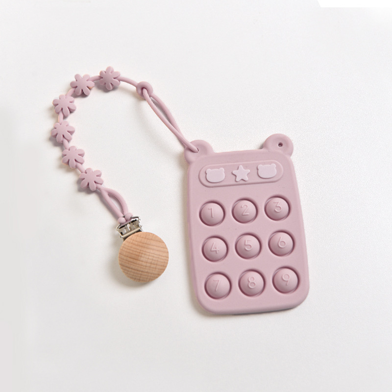 Juguete de clic morado + cadena anticaída de flores con clip de madera