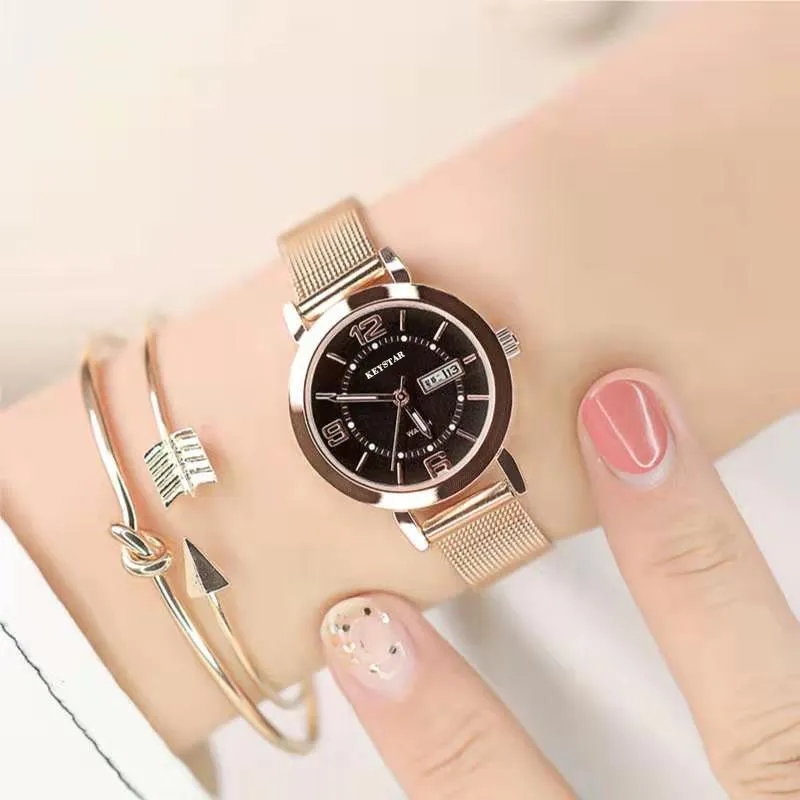 Rose gold-black faced female