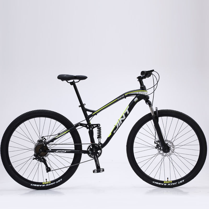 Black and green 9-speed hydraulic brakes with brown sidewall tires