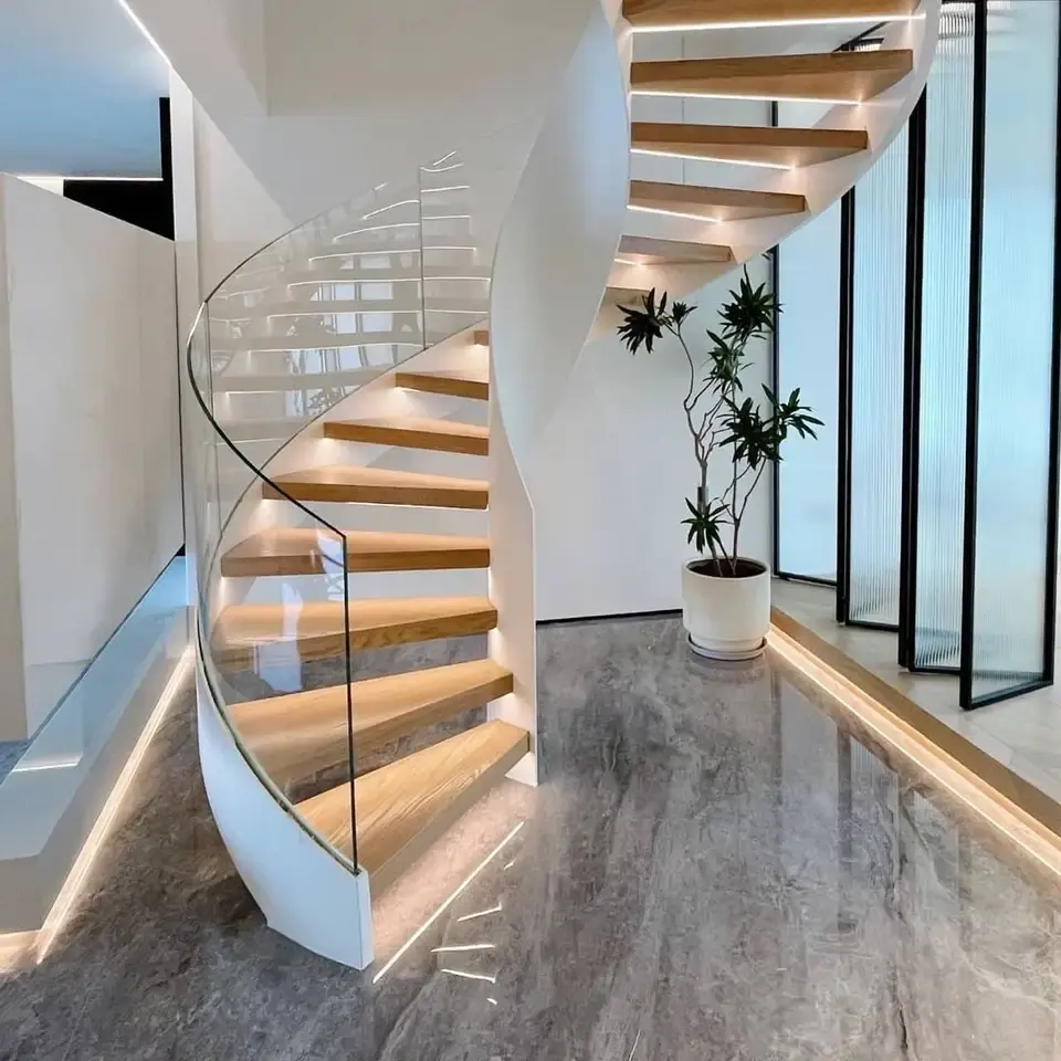 Escalera de Caracol curvada de vidrio templado laminado, escalera flotante de forma redonda de vidrio metálico usado en el interior del hogar con diseño personalizado