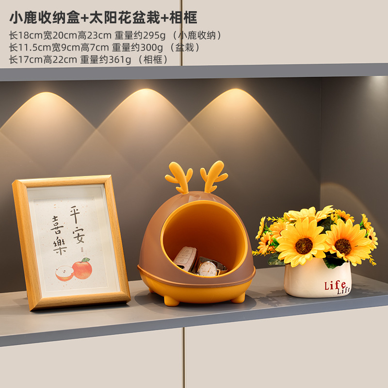 Deer storage box, sunflower potted plant, photo frame