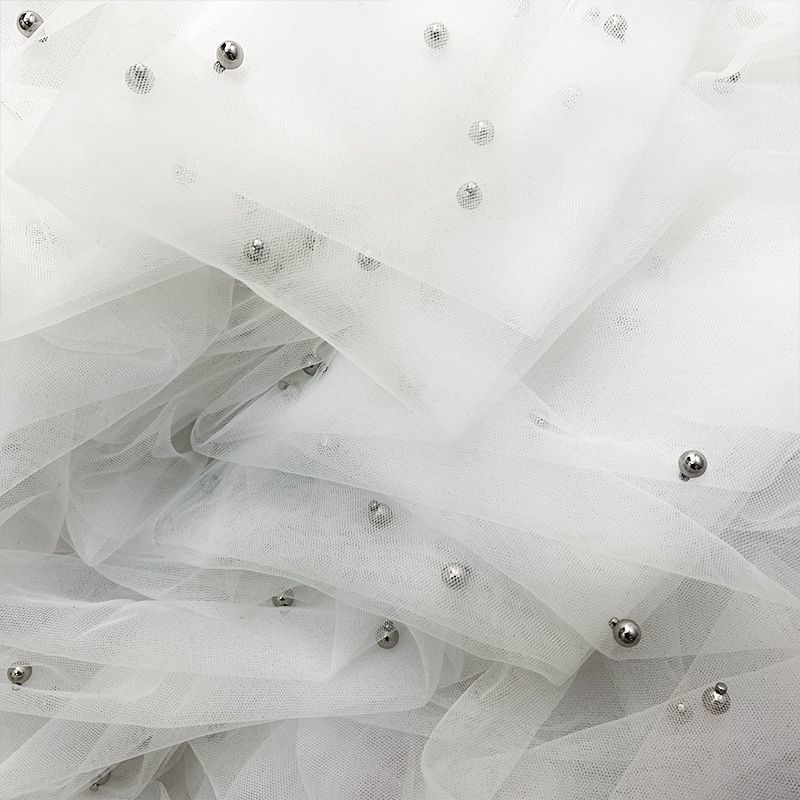 White yarn highlight silver beads