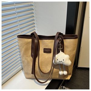 Yeni moda kadının büyük kapasiteli Tote çanta Zip kapatma ile günlük kot kumaş iki kolları deri veya PU astar