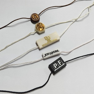 Sujetadores colgantes de plástico con logotipo en relieve 3D personalizado redondo, etiqueta de sellado, cuerda de cera de nailon para zapatos y ropa - Product Image 1