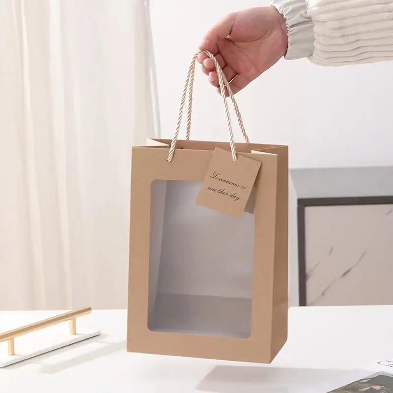 Sacchetti di carta d'imballaggio del regalo di acquisto riciclabile del sacchetto di carta del mestiere di Logo personalizzato all'ingrosso con la finestra del PVC