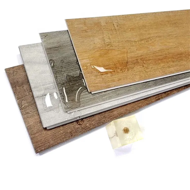 Revêtement de sol PVC SPC en plastique de style bois de vinyle de planche auto-adhésive durable imperméable ignifuge